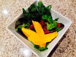 Mangos, mixed greens, and candied pecans
